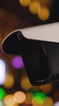 A nighttime security camera featuring a beautiful bokeh background with shimmering lights