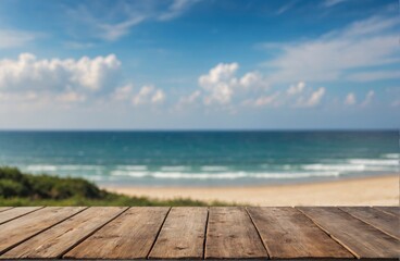 A weathered wooden deck offers a stunning view of the tranquil beach and endless blue ocean.