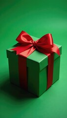 Obraz premium Gift box with red ribbon on festive green background, bow, decoration