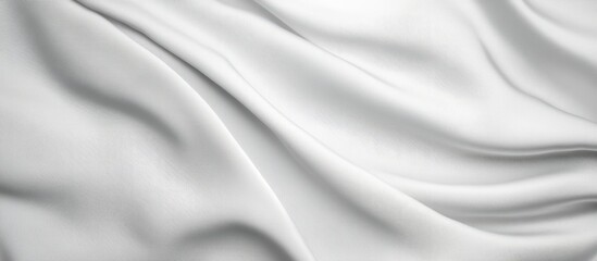 Elegant rippled white fabric texture for backgrounds and design elements showcasing soft folds and smooth surfaces.