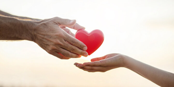 Abstract background. Valentine's Day concept with love and trust with giving a red heart. compassion, family, giving, sharing, generosity, support, relationships