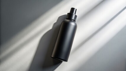 Luxurious matte black cosmetic bottle, soaring aerial drone shot.  Unveiling elegant beauty packaging design.