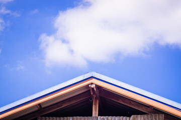 Roof Gable Against Blue Sky with Clouds, png transparent