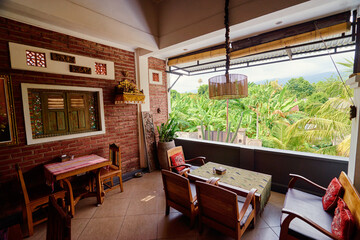 Cozy Sem-Open Tropical-Themed Dining Room with Scenic Garden View..