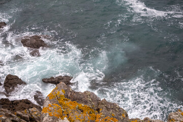 waves crashing on rocks