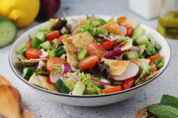 A bowl with Fattoush - Traditional Levantine salad	
