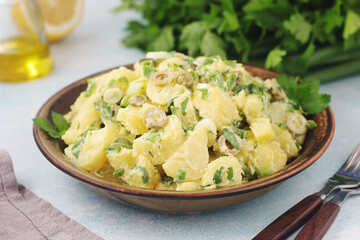 A bowl with Greek potato salads