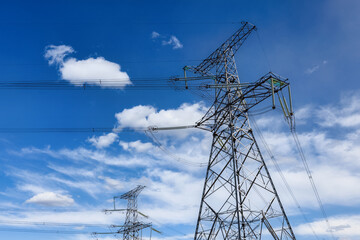 high-voltage transmission tower under a clear sky