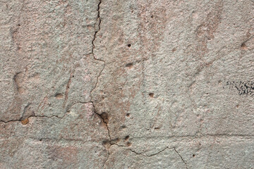 The old cracked cement and dirt and corrosion
