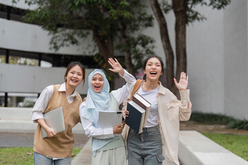 Diverse university students happily waving, celebrating friendship and campus life.