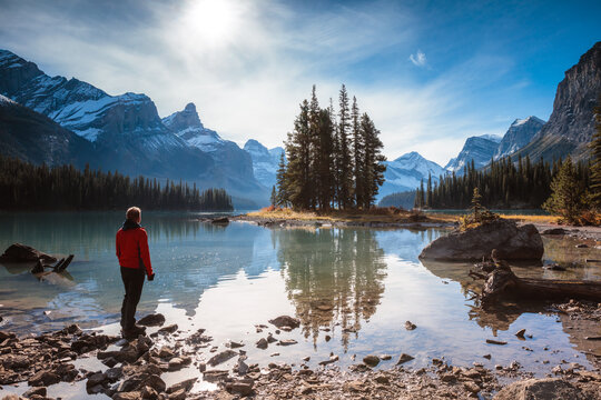 Man looking at Spirit Island, Maligne lake, Jasper, Canada