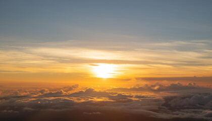 Sun Setting Over Clouds in Sky and Copy Space
