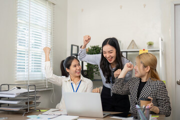 Team celebration of business success office environment digital content collaborative workspace positive energy