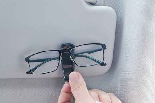 Glasses clip mounted on the car sun visor