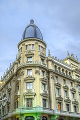 Obraz premium Old domed tower in a corner of an apartment building, Madrid, Spain