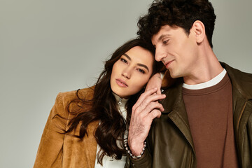 Captivating young couple showcasing trendy fashion in a stylish indoor setting © LIGHTFIELD STUDIOS