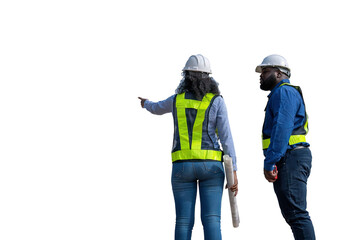 Engineers wearing safety gear, including hard hats examining survey standing industrial facility...