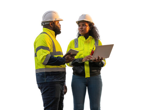 Engineers wearing safety gear, including hard hats examining survey standing industrial facility engaged in a job requires high safety standards concept with PNG white background.	