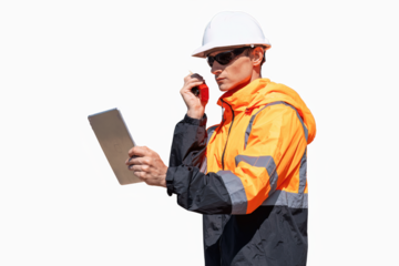 Engineers wearing safety gear, including hard hats examining survey standing industrial facility engaged in a job requires high safety standards concept with PNG white background.	