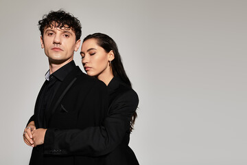 Fashionable young couple exuding style in modern urban setting