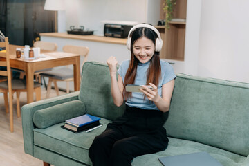 Obraz premium lifestyle Happy woman looking at tablet and cellphone screen.