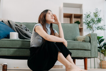 Lonely  Depressed Young Woman Sitting on Sofa, Sad Mood.