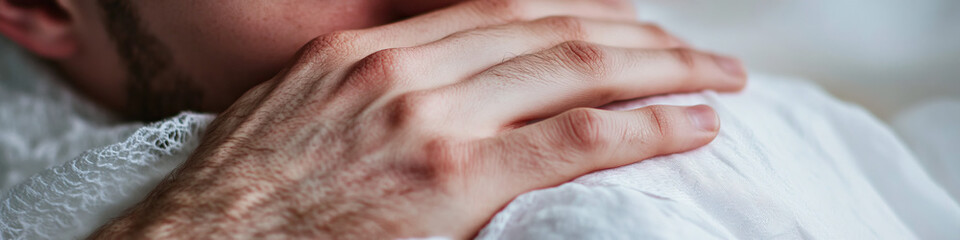Fototapeta premium Close-up of Hand on Shoulder