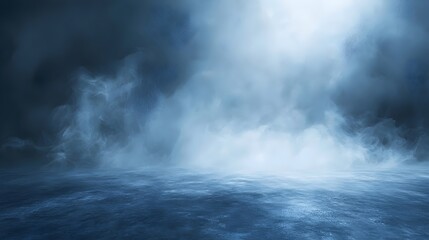Fototapeta premium A mystical fog envelops a serene landscape, creating an ethereal atmosphere. The cool blue tones evoke a sense of calmness and mystery in this tranquil scene.