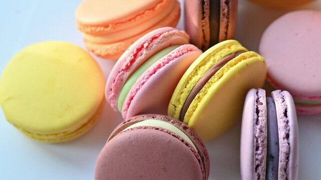 Colorful colorful macaroons are spinning. demonstration of the range of macaroons.