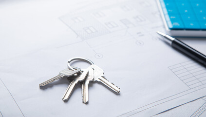 House keys on architectural project plan.