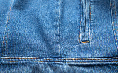 Naklejka premium Blue denim background. Closeup view