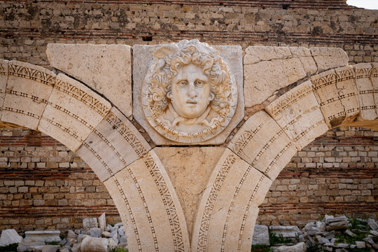 Head of gorgon Medusa in the ruins of Roman city of Leptis Magna in Libya