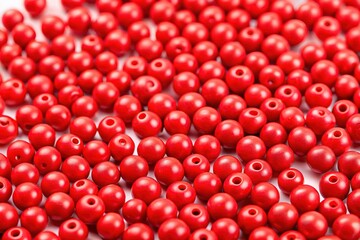 White backdrop showcases red beads' thirds rule.