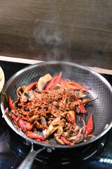 food view colorful food being prepared in a pan, home cooking, peppers, chicken, onions,