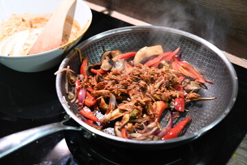 food view colorful food being prepared in a pan, home cooking, peppers, chicken, onions,