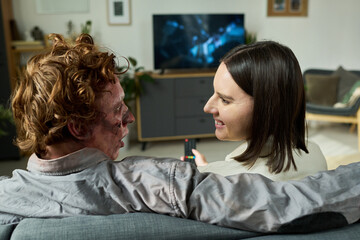 Fototapeta premium Unusual Young Couple Discussing Movie