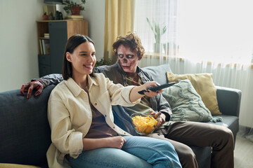 Unusual Couple Choosing Movie On TV