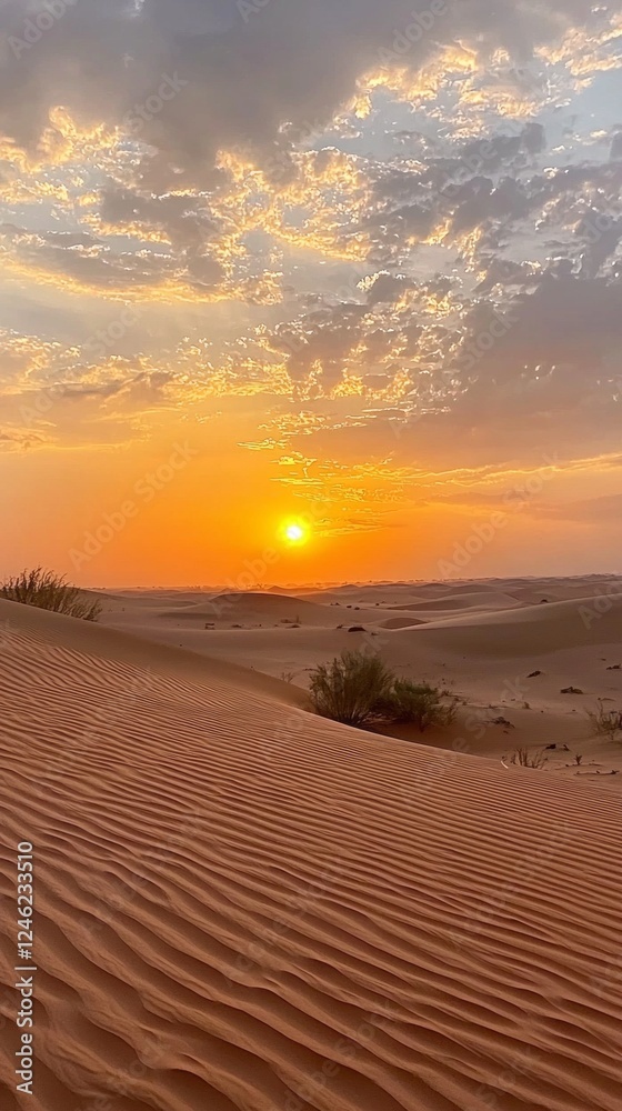 Poster As the sun dips below the horizon, the desert transforms into a canvas of gold and orange. Silhouetted dunes showcase intricate patterns under a colorful sky, inviting tranquility and reflection