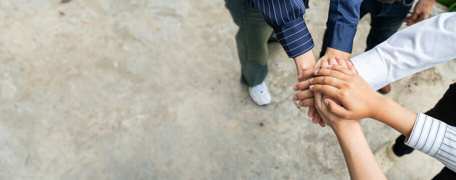 Teamwork,join,Volunteer charity,empathy,unity and success business concept,group of friends put their hands together with copy space.Joined hands for teamwork.