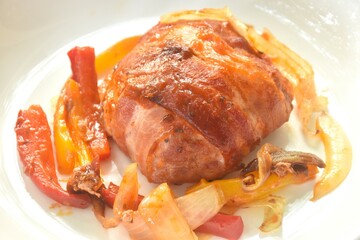 baking mashed burger pork wrapped bacon with cheese with chili and onion on plate