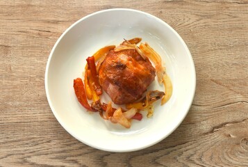 baking mashed burger pork wrapped bacon with cheese with chili and onion on plate