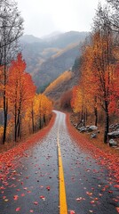 Obraz premium A winding road through the mountains in autumn.