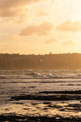 Golden light on the beach shore.