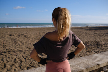 Woman Seen From Back, Sportswear, Skating, Looking At The Beach, Healthy Living, Leisure And Sport, Happiness