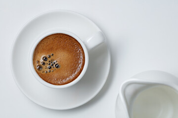 Cup of coffee on a white background. Flat lay