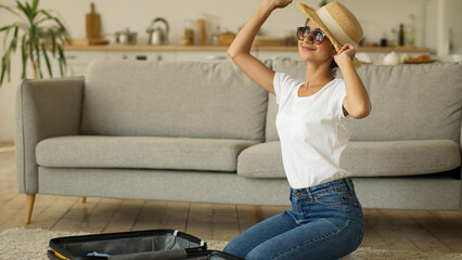 Indian woman Arabian female ethnic girl Hindi lady at home indoors preparing for trip prepare for...