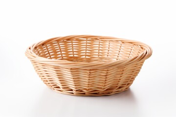 Fototapeta premium Woven wicker basket with a natural finish suitable for serving bread or fruits in a dining setting
