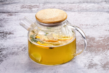 Teapot with orange and mint tea