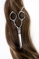 long hair and a pair of scissors