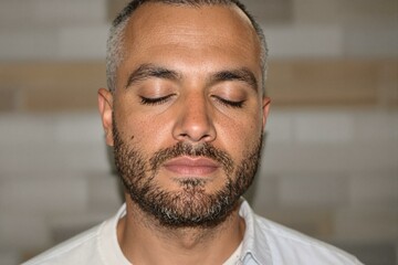 Fototapeta premium Tranquil Male Meditator in Portrait Style